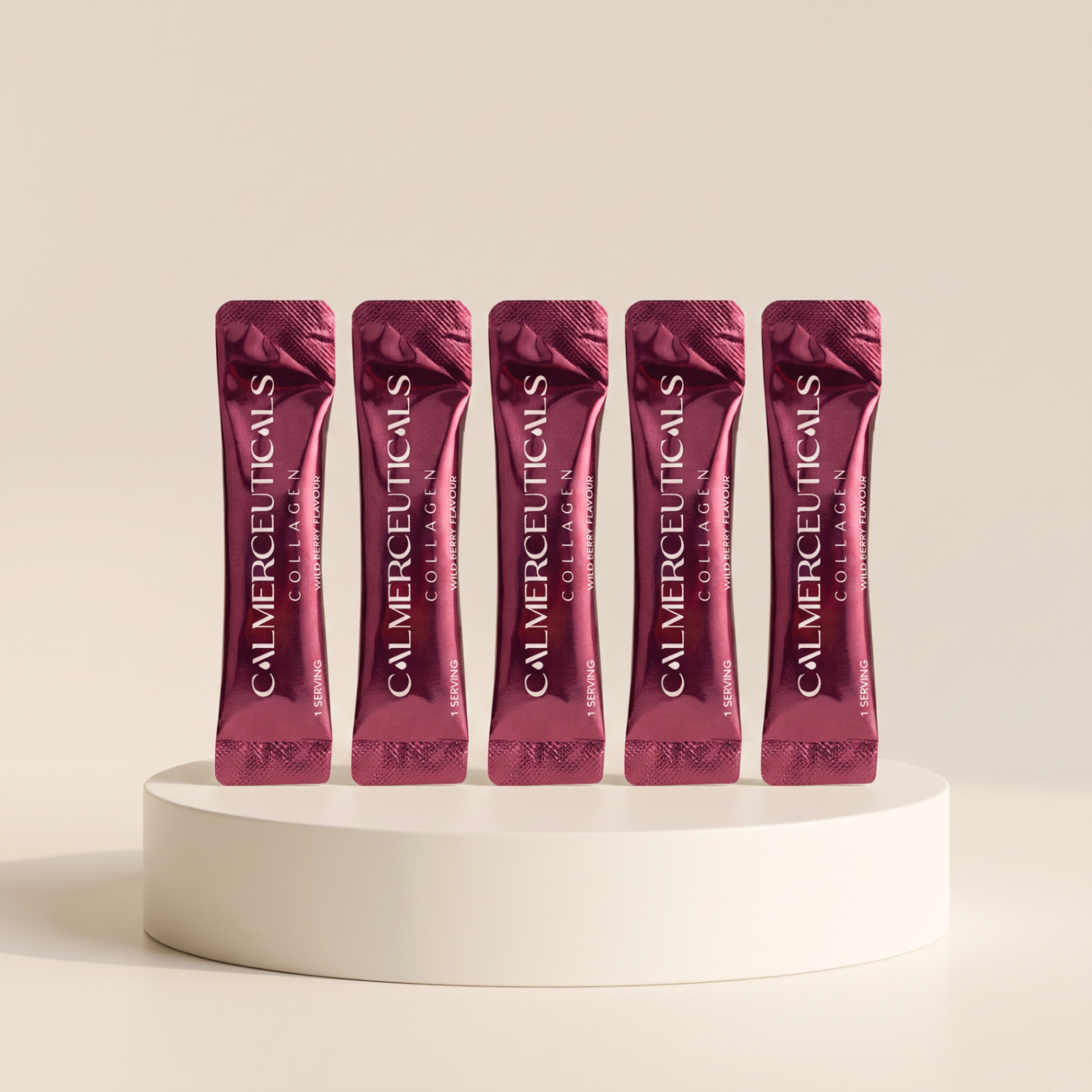 5 Calmerceuticals Wild Berry collagen sachets on a cream pedestal — Welcome Kit bonus